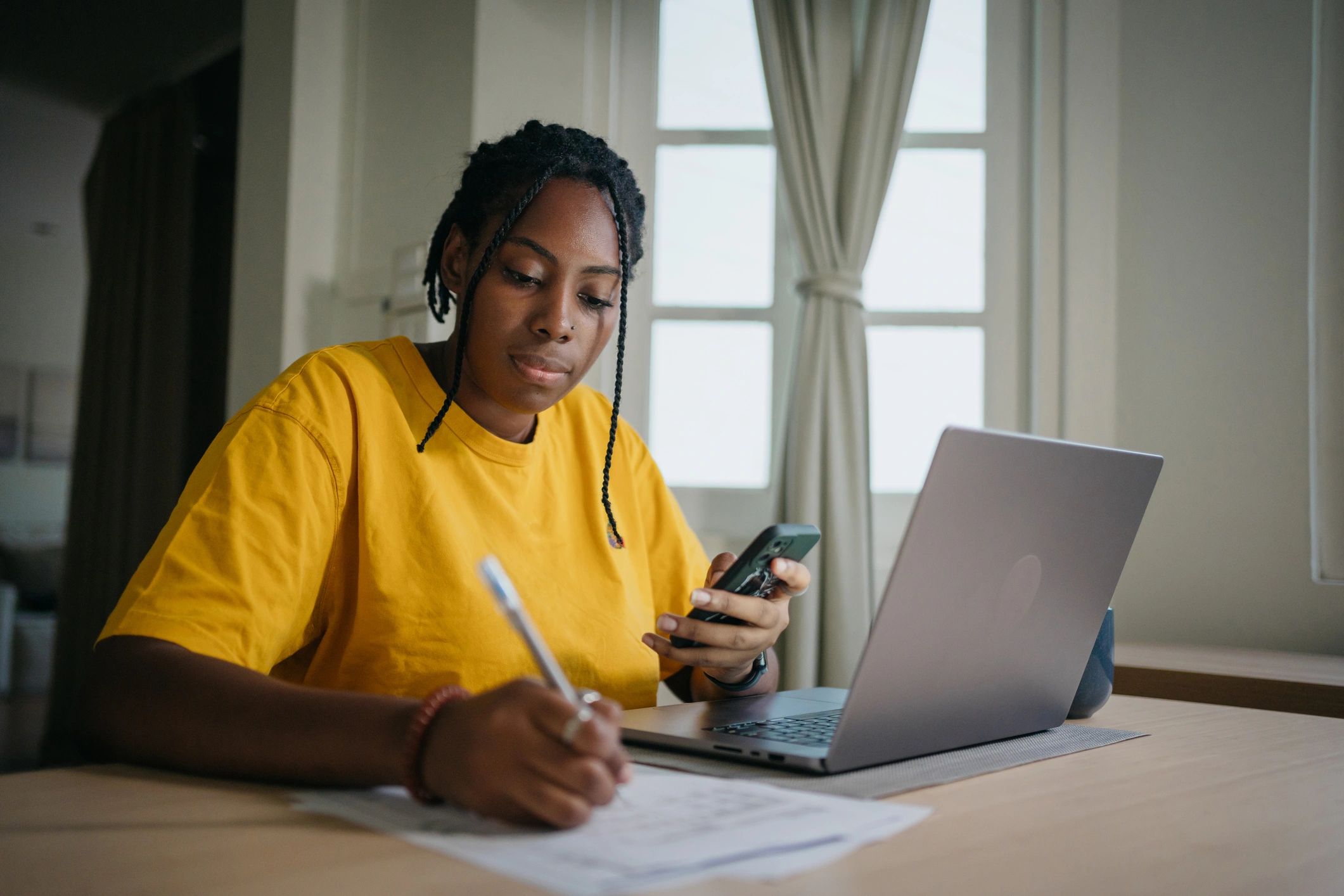 Person budgeting and planning at home