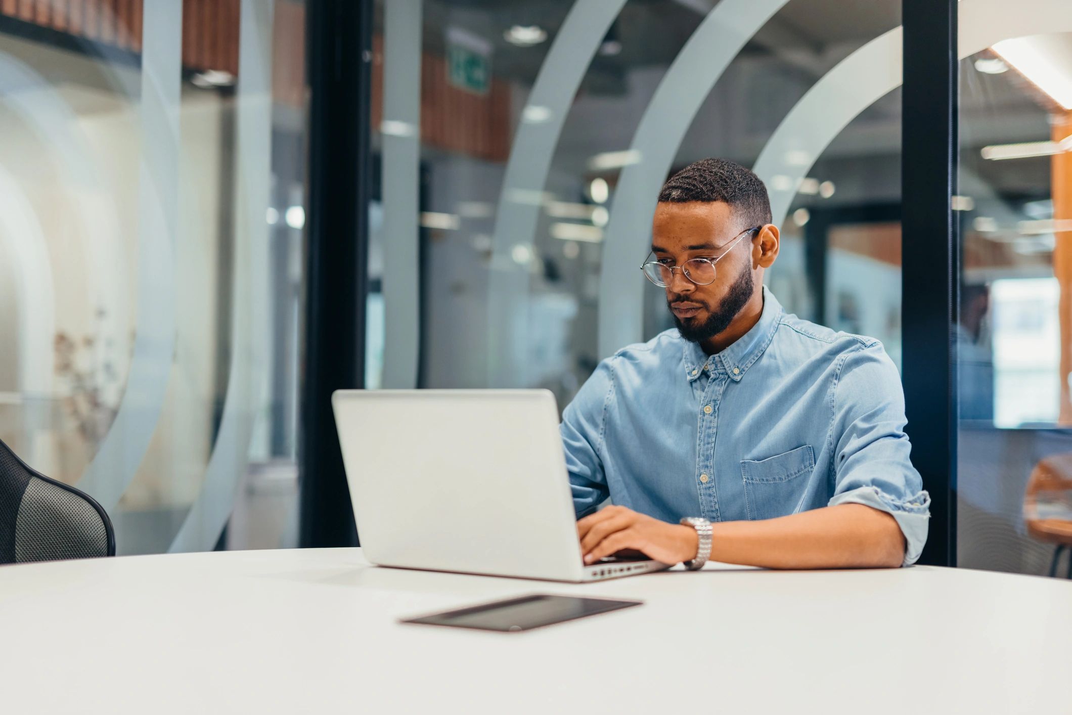 Freelancer working on a laptop in a coworking space