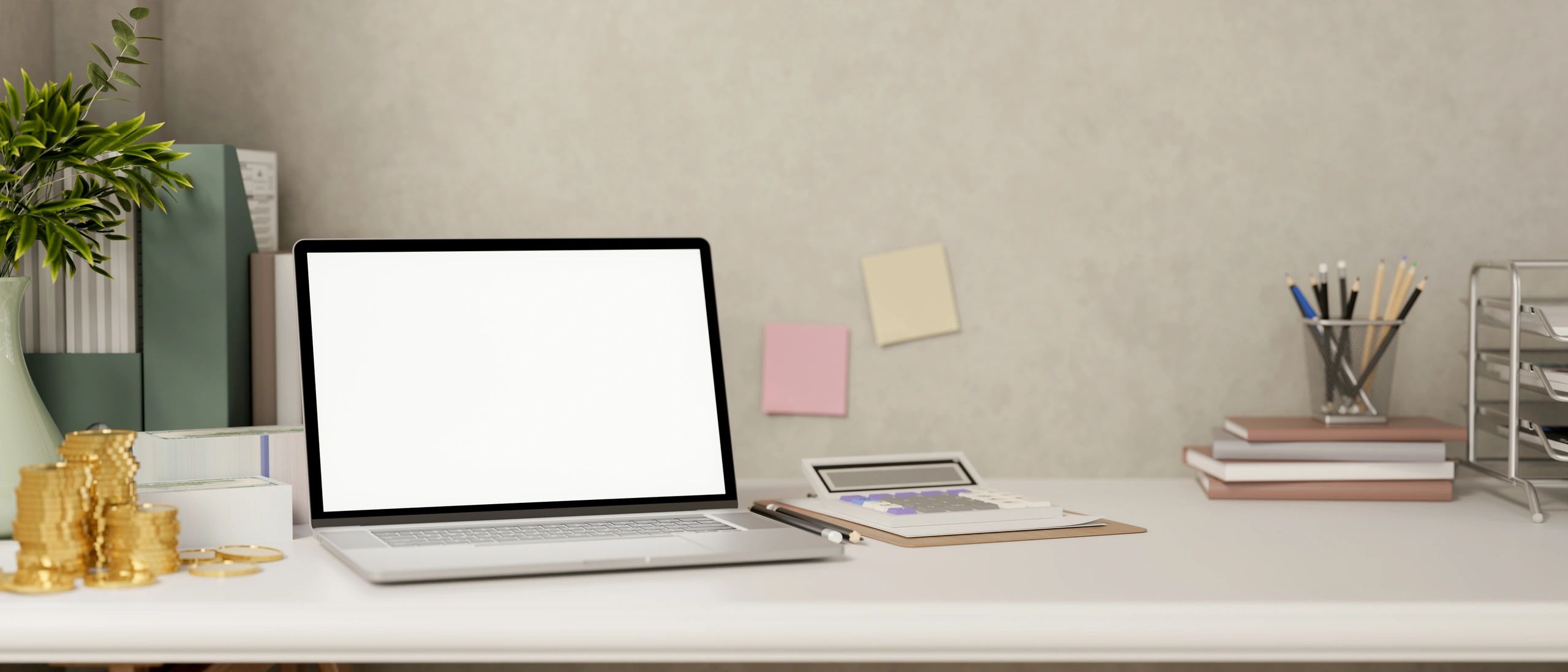 Laptop on desk with calculator and coins