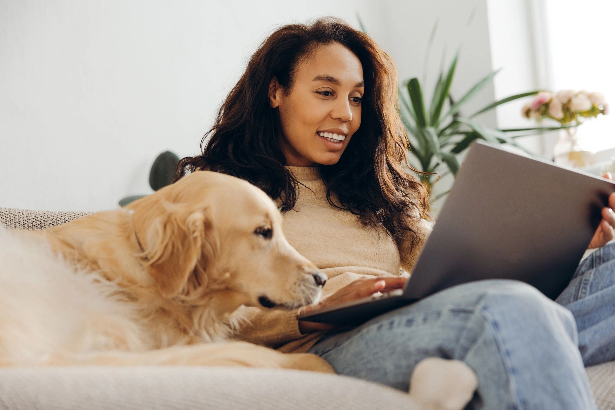 Woman working on a laptop at home